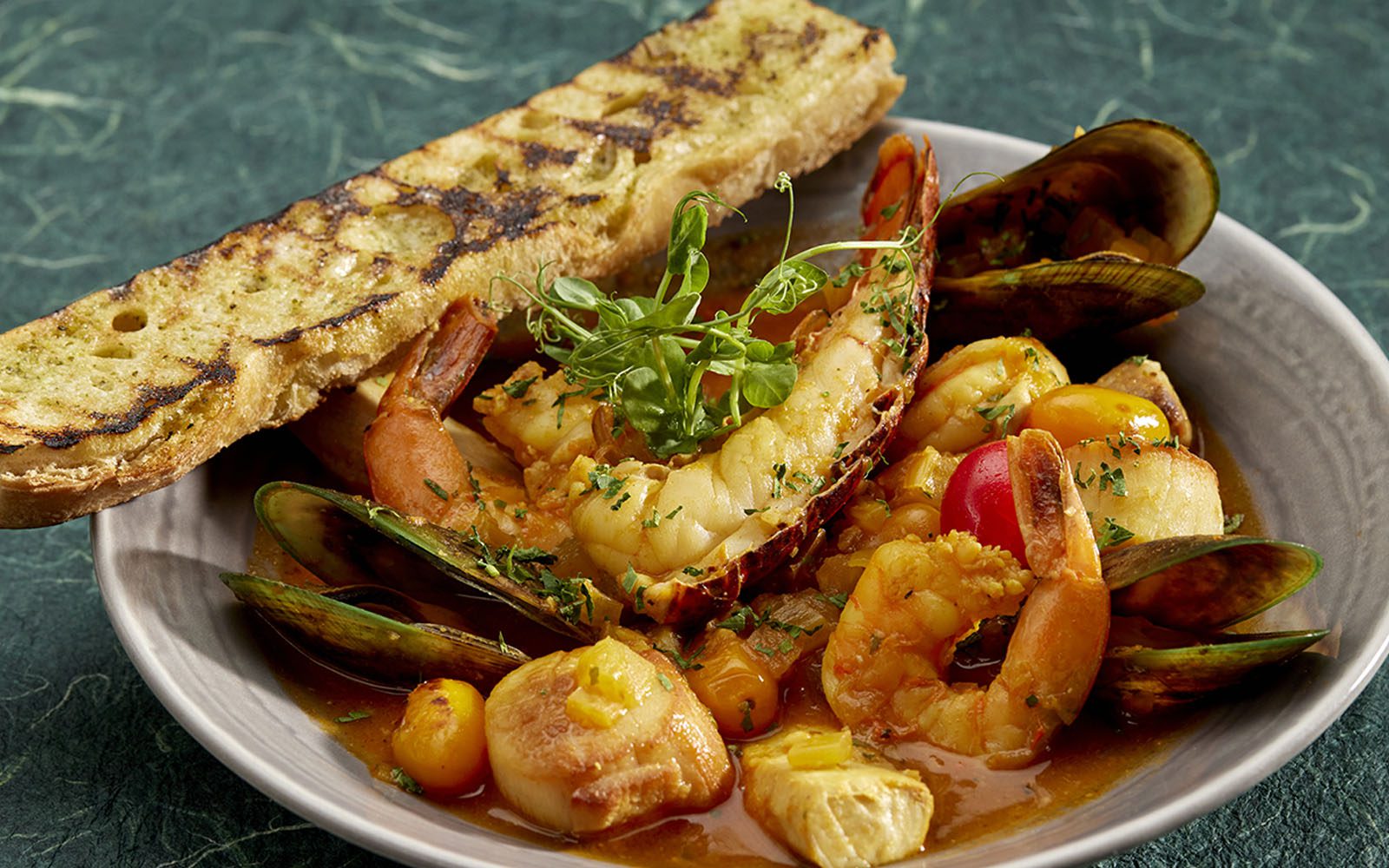 A photo of seafood bouillabaisse at the Bali Oceanfront