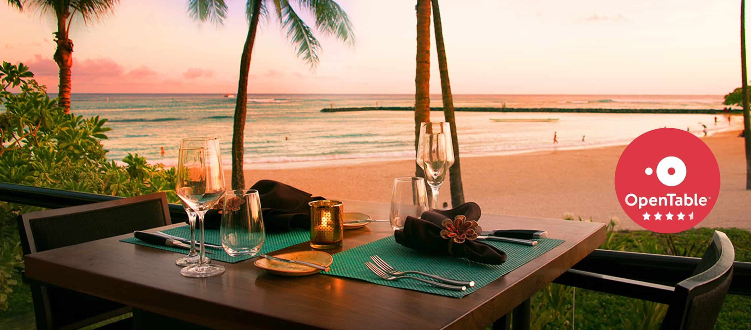 Beachfront dining table at Bali Oceanfront at Sunset with an opentable icon in red with 4.5 stars