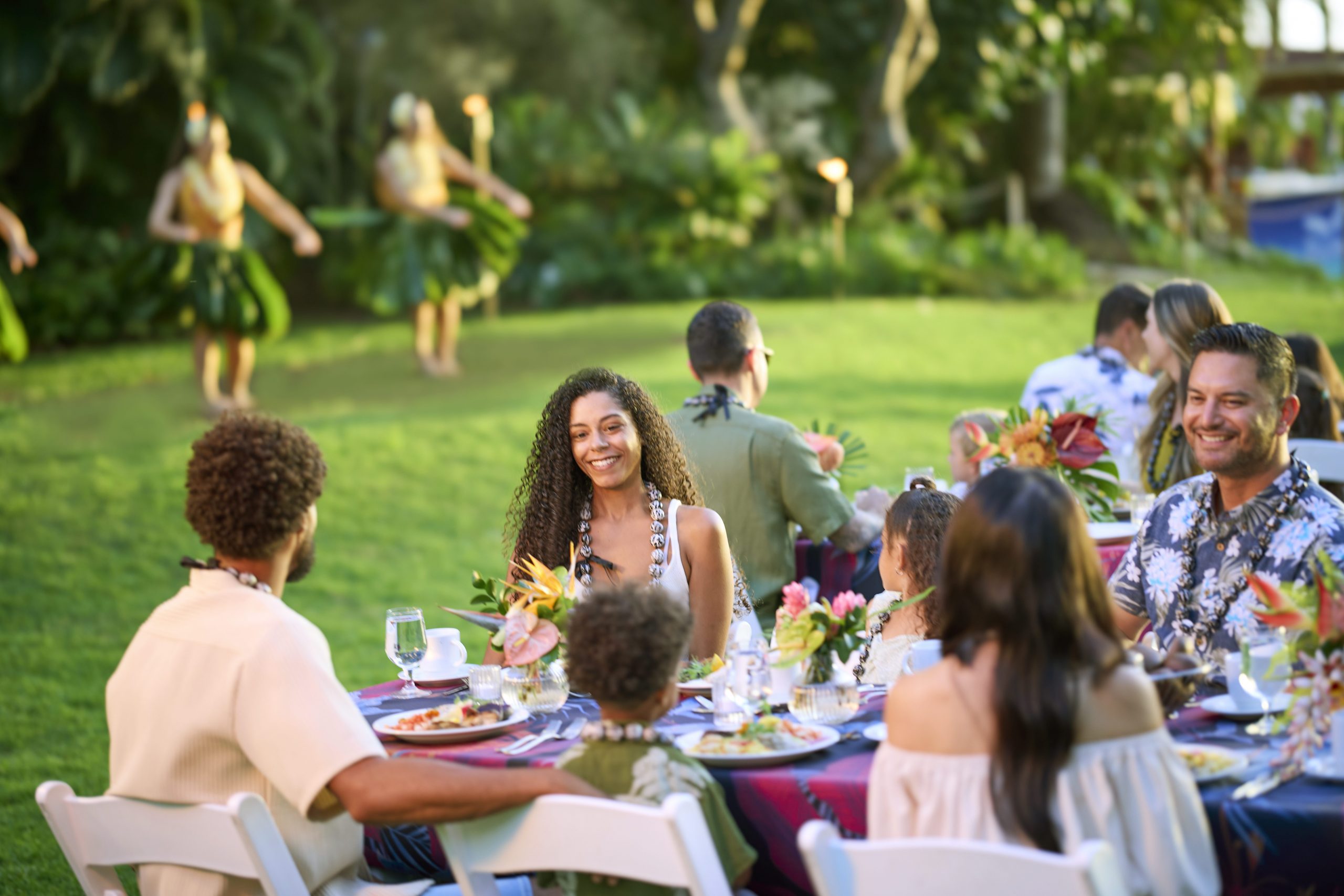 A photo of people smiling at the Waikiki Starlight Luau