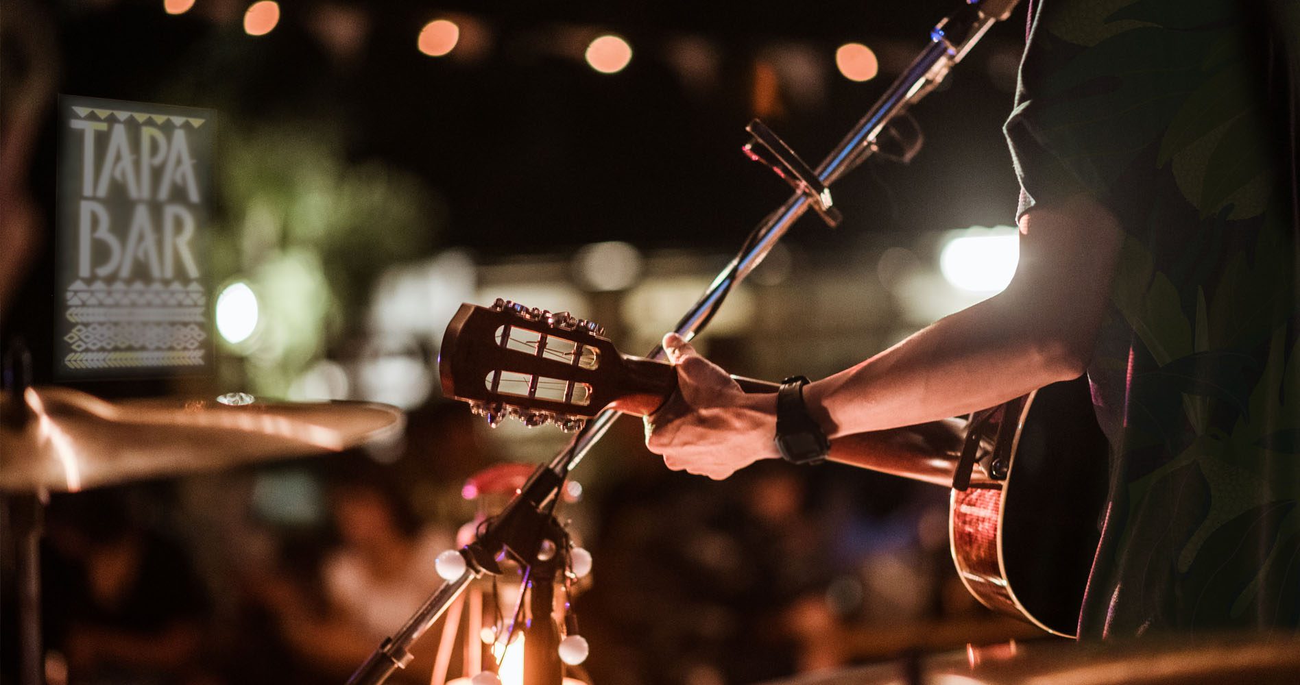 Photo of a live band playing at the Tapa Bar