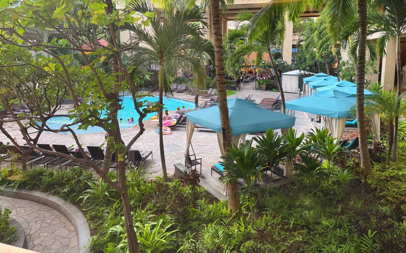 Tapa Pool Terrace with blue topped cabanas