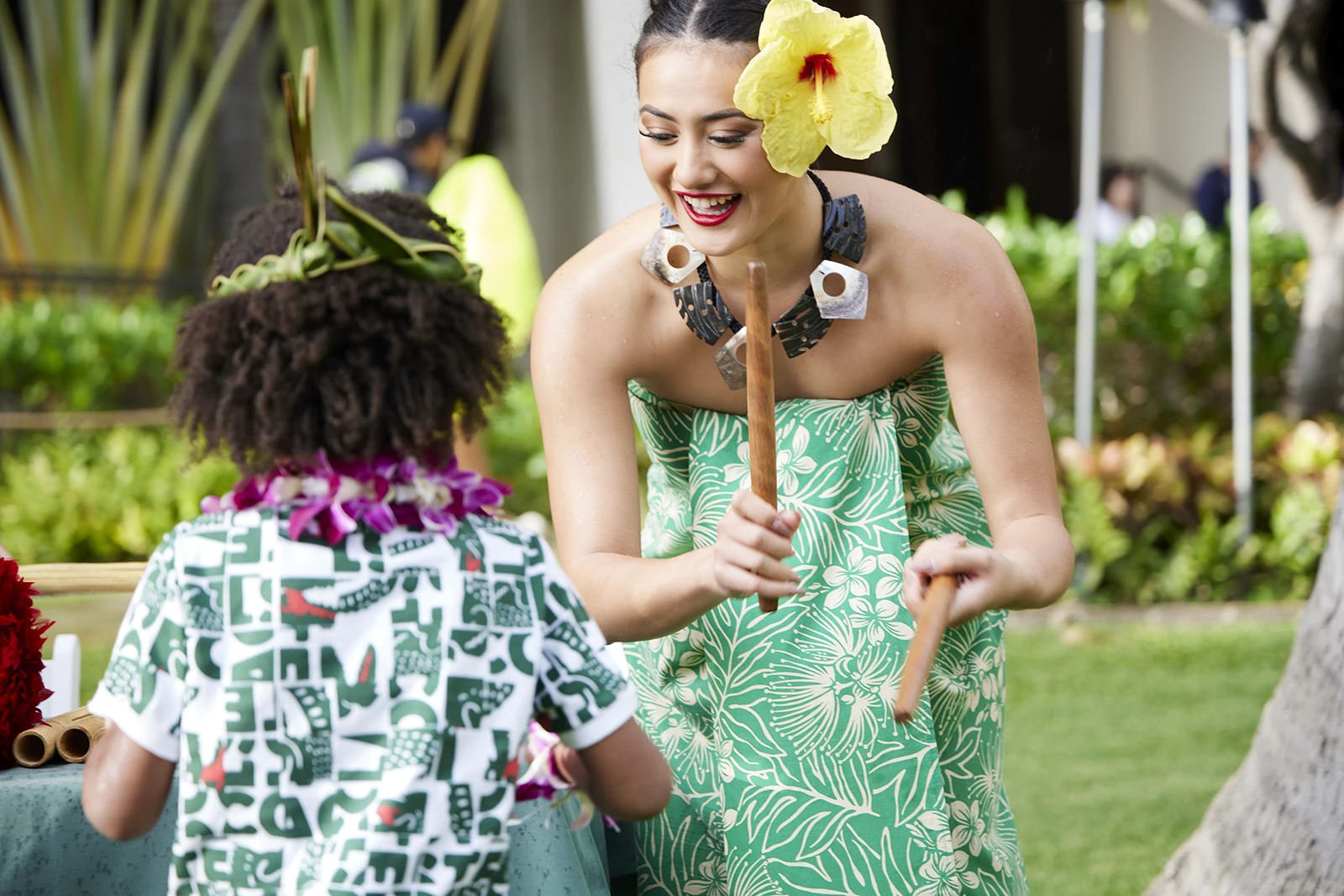 Playing percussive instruments at the Waikiki Starlight Luau