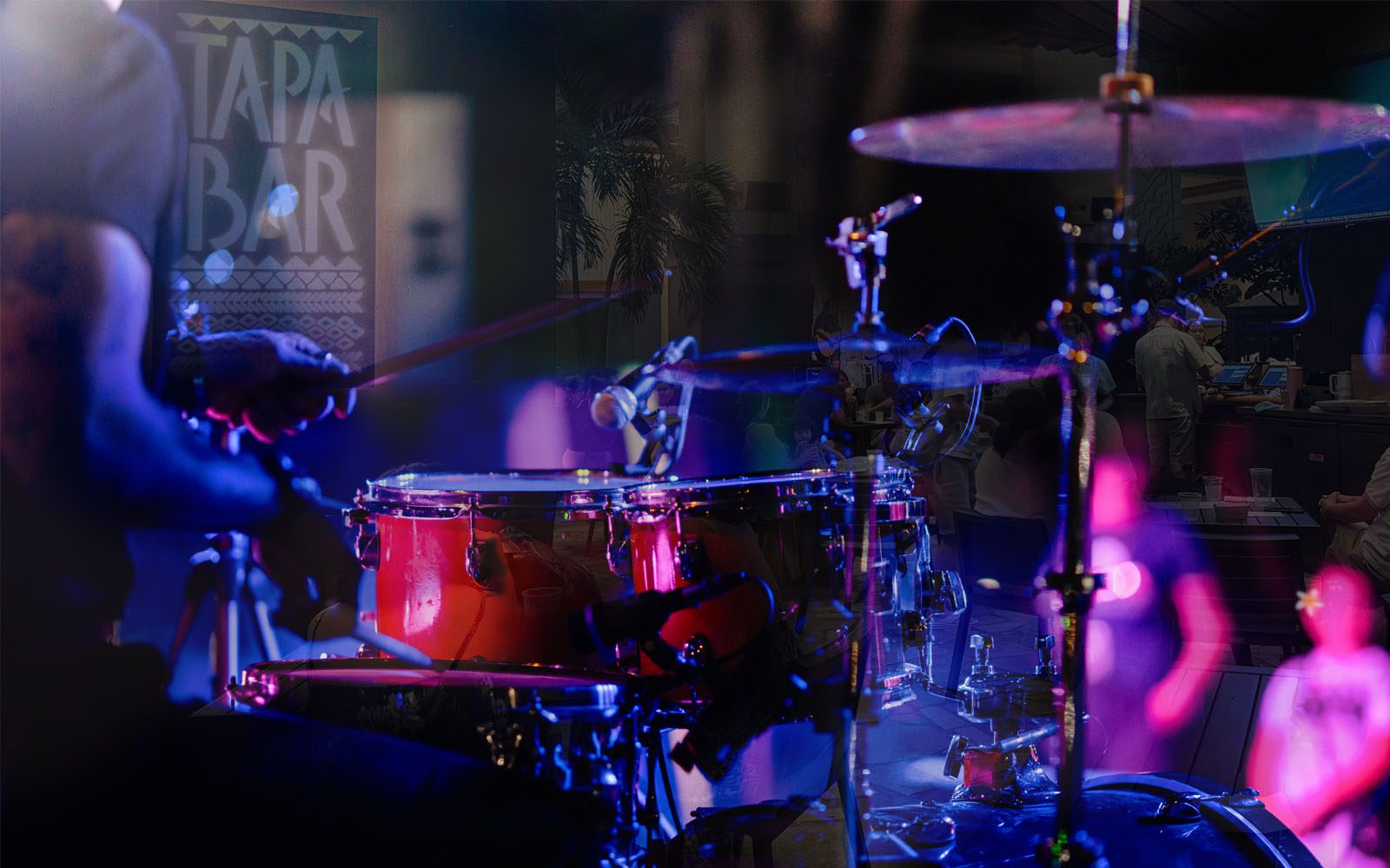 Photo of a live band playing at the Tapa Bar