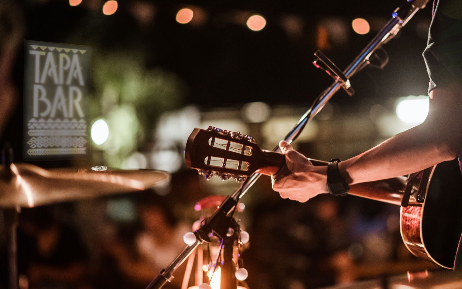 Photo of a live band playing at the Tapa Bar