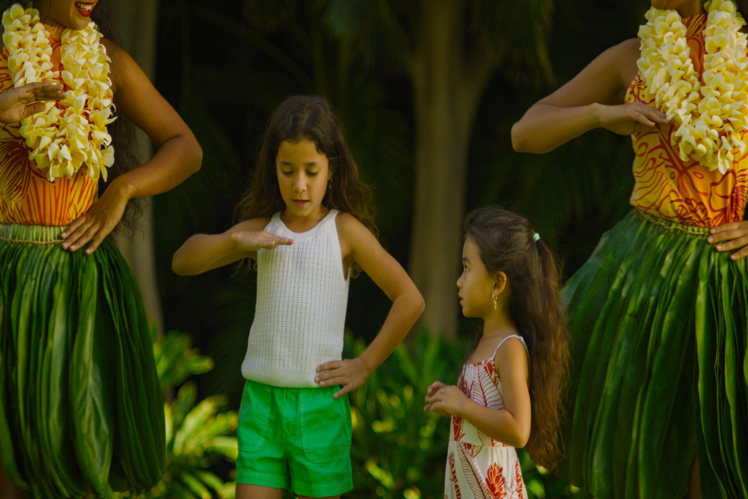 kids dancing hula with instructors