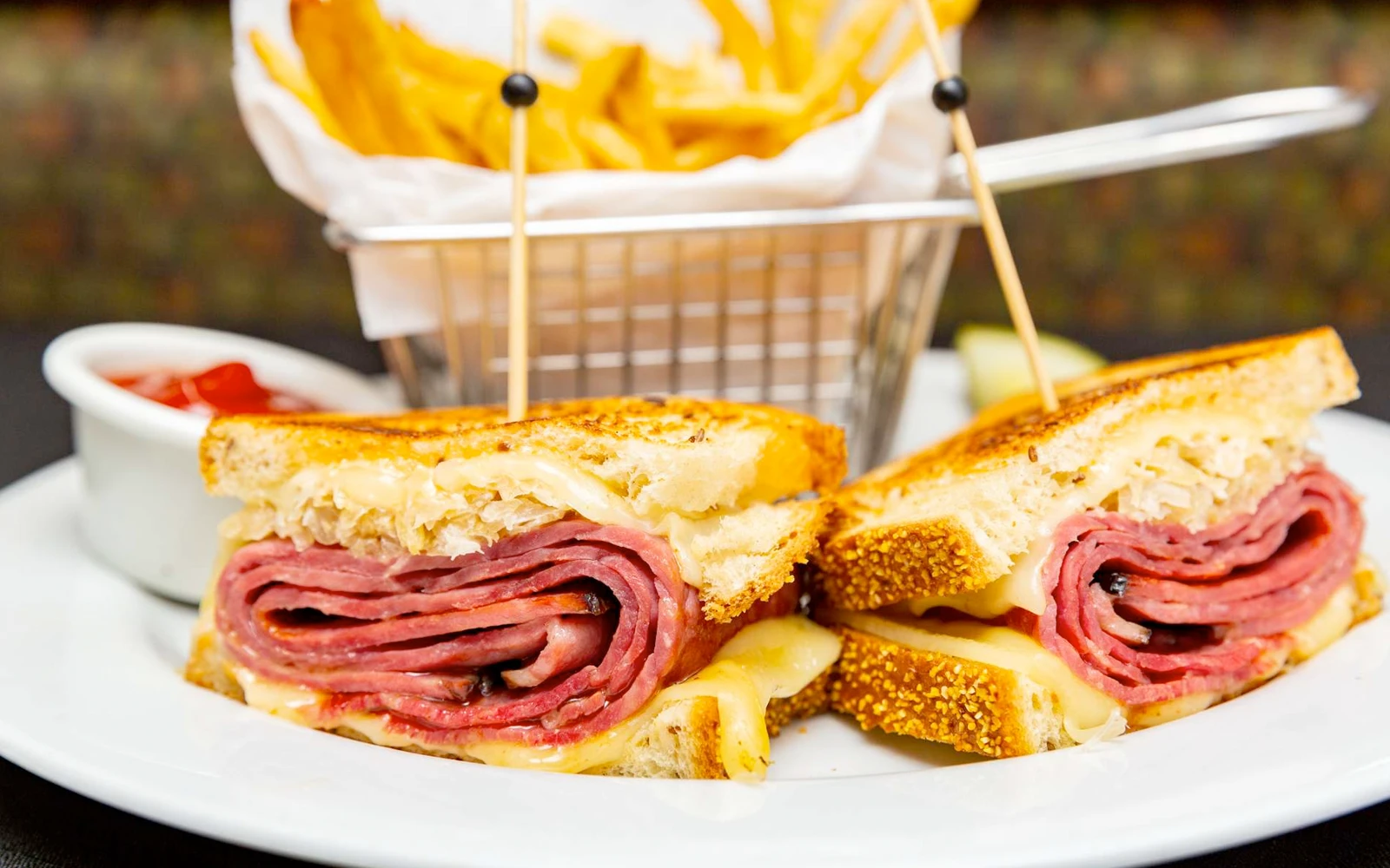 Photo of a Pastrami sandwich and fries from CJ's New York Style Deli at the Hilton Hawaiian Village