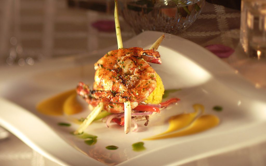 Shrimp skewers on a white plate and plated as an appetizer