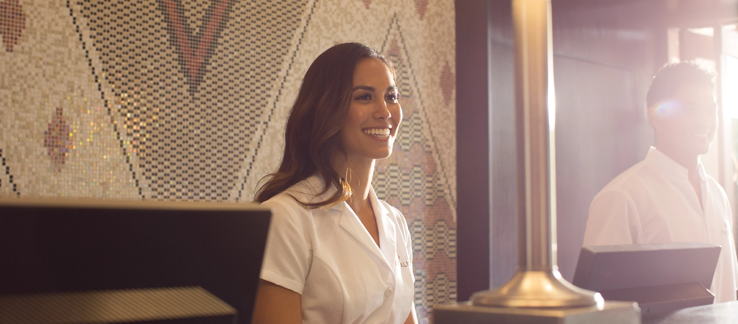 Photo of a smiling employee at the Hutton Hawaiian Village